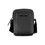 Calvin Klein black shoulder bag with sleek design and logo detail, featuring a structured shape and adjustable strap.