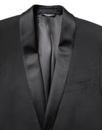 Dolce & Gabbana black single-breasted men's blazer with notch lapel and tailored fit, displayed on a hanger.