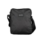 Calvin Klein black polyester men's shoulder bag with adjustable strap and minimalist design, suitable for everyday use.