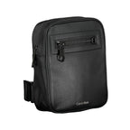 Calvin Klein black polyester men's shoulder bag with adjustable strap and sleek design, suitable for casual or professional use.