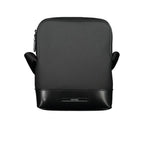 Calvin Klein sleek black shoulder bag with contrasting details, featuring a modern design and adjustable strap.
