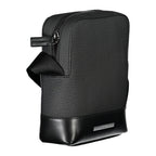 Calvin Klein sleek black shoulder bag with contrasting details, featuring a modern design and adjustable strap.