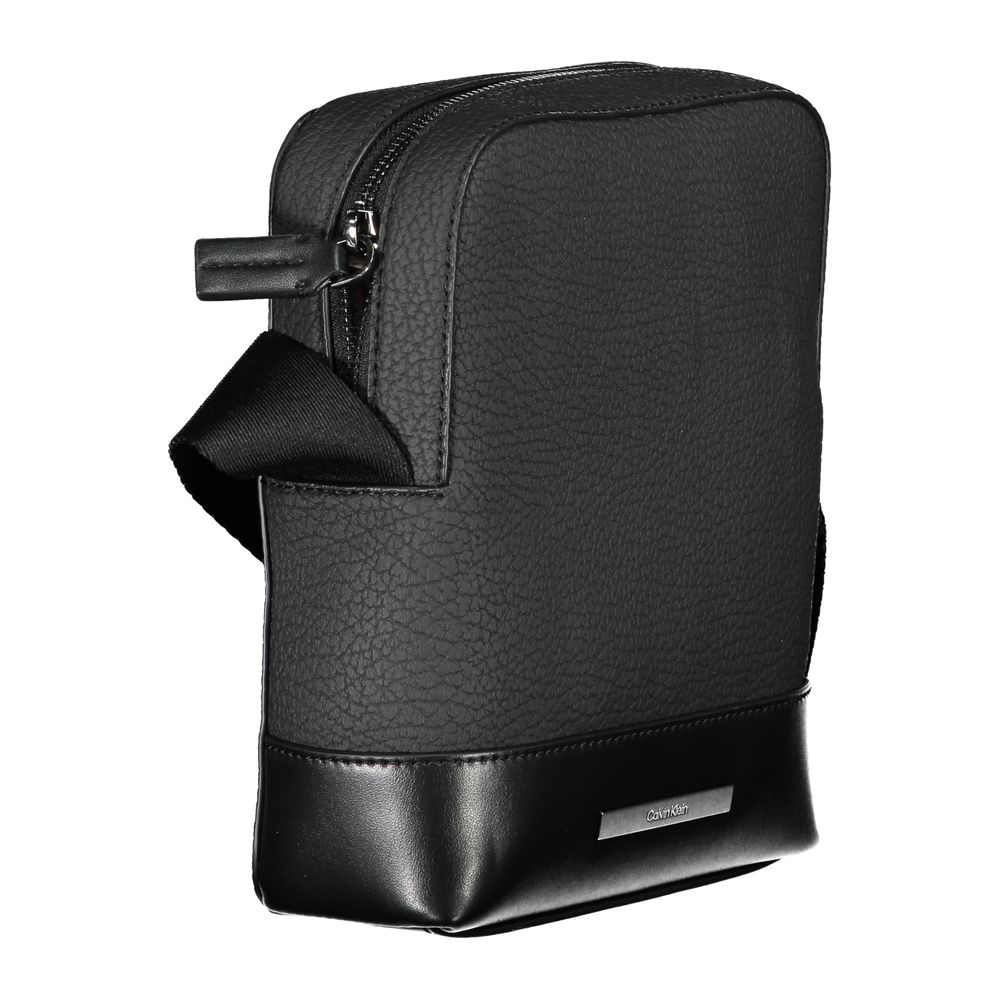 Calvin Klein sleek black shoulder bag with contrasting details, featuring a modern design and adjustable strap.