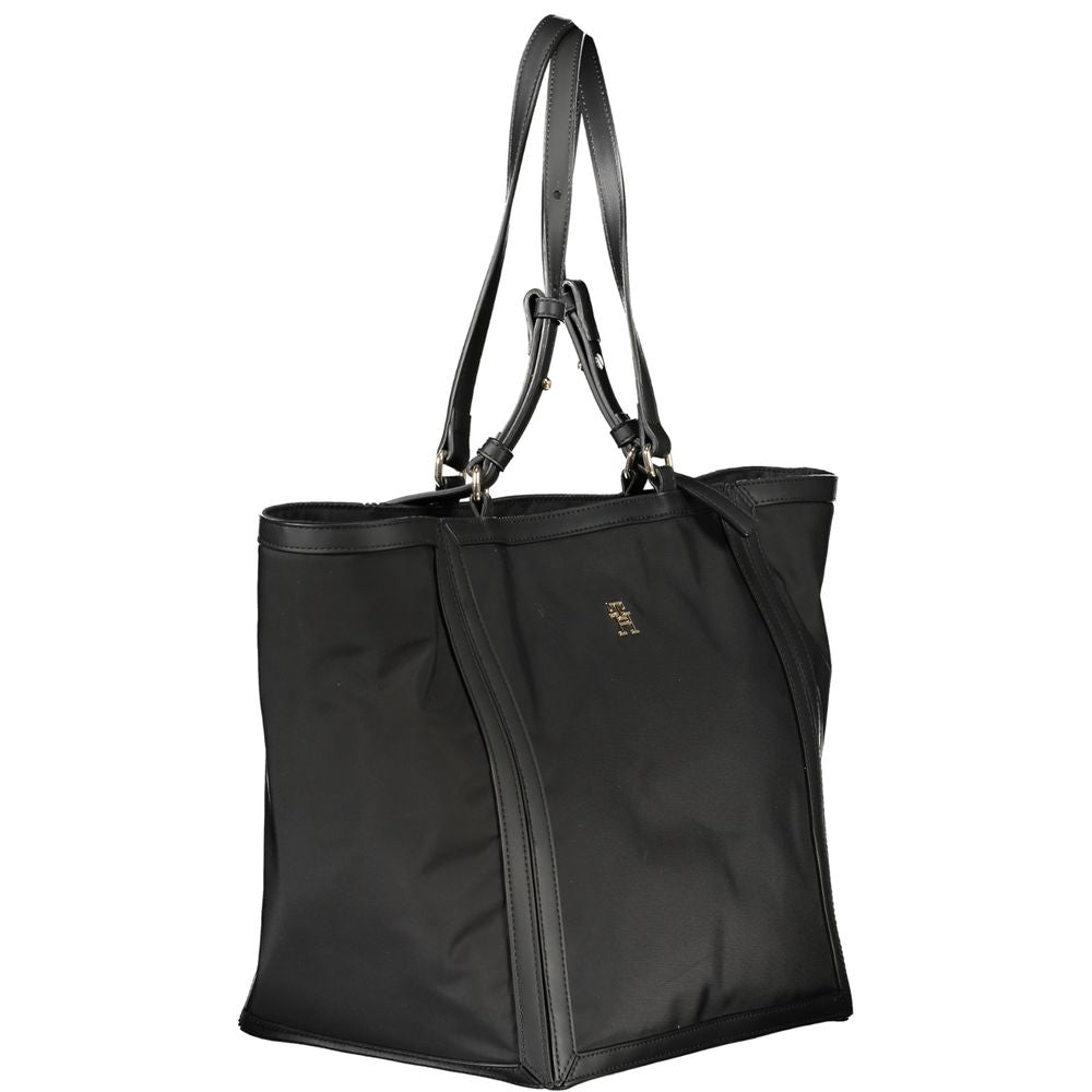 Black polyester women’s handbag by Tommy Hilfiger with sleek design and subtle logo detail.