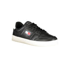 Tommy Hilfiger black leather men's sneaker with white sole and classic design, showcasing stylish casual footwear.