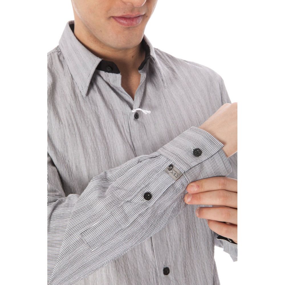 White cotton men's shirt by Costume National, featuring a classic fit and button-down collar, displayed on a hanger.