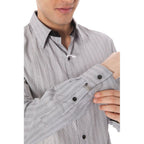 White cotton men's shirt by Costume National, featuring a classic fit and button-down collar, displayed on a hanger.
