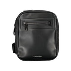 Black Calvin Klein polyester men's shoulder bag with adjustable strap and minimalist design, suitable for everyday use.