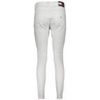 Tommy Hilfiger Bianco cotton women's jeans displayed on a model, featuring a classic five-pocket design and slim fit.