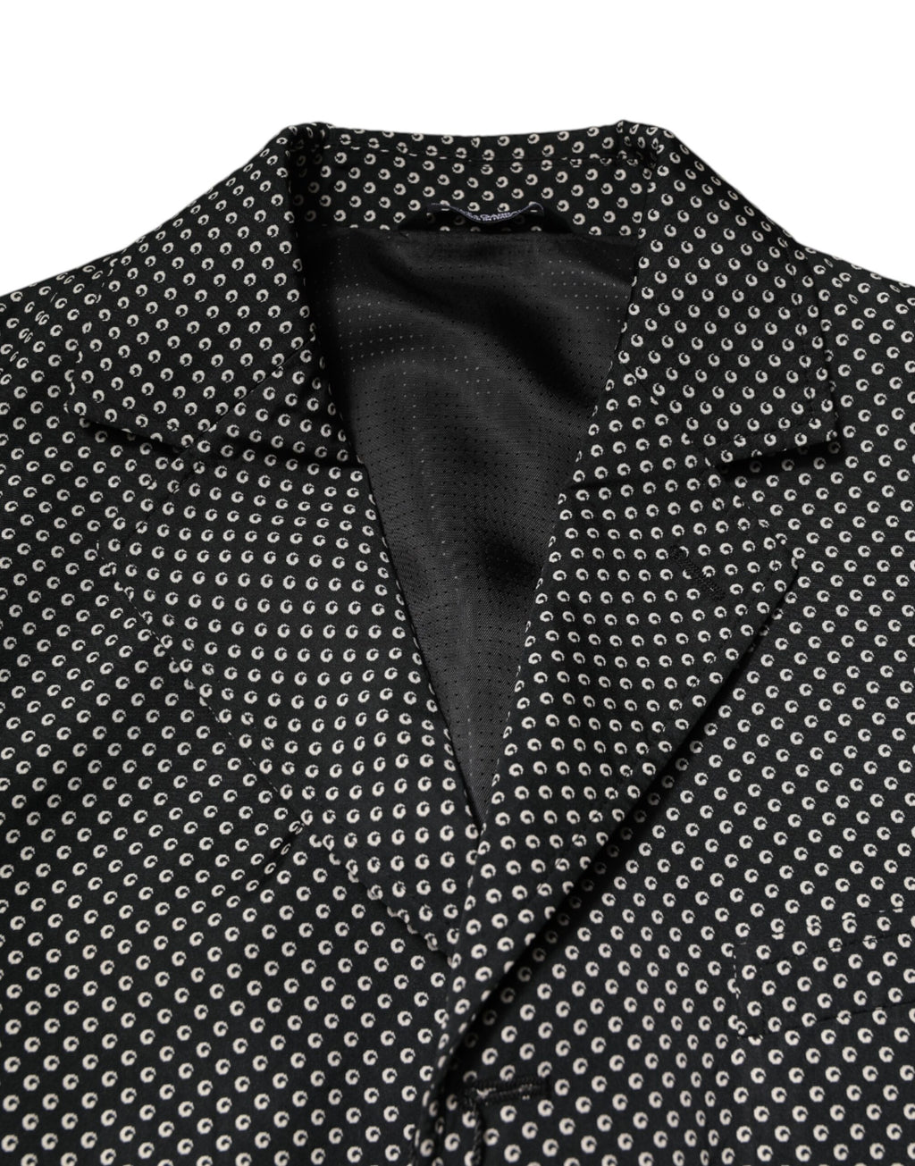 Dark gray Dolce & Gabbana men's patterned suit blazer with white accents, tailored fit, and classic lapel design.