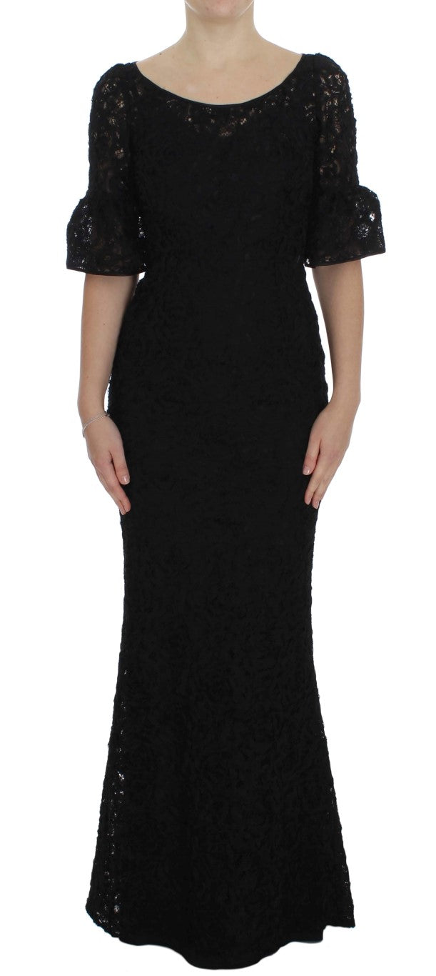 Dolce & Gabbana black floral lace long bodycon maxi dress displayed on a dress form, showcasing intricate lace details and fitted silhouette.