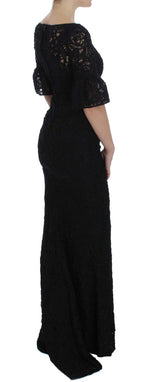 Dolce & Gabbana black floral lace long bodycon maxi dress displayed on a model with intricate lace details and a sleek silhouette.