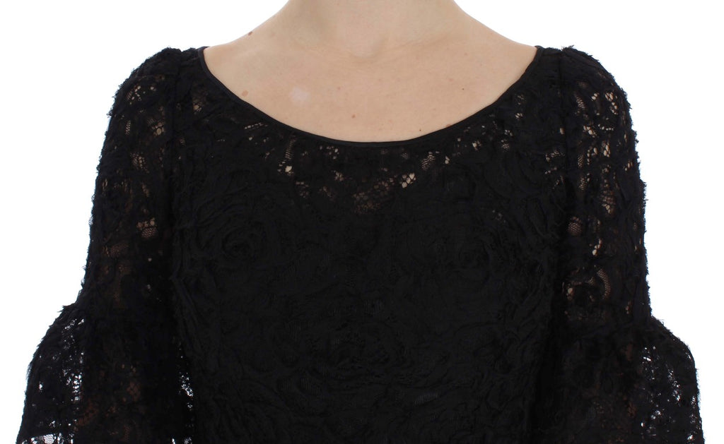 Dolce & Gabbana black floral lace long bodycon maxi dress displayed on a hanger with intricate lace details and fitted silhouette.