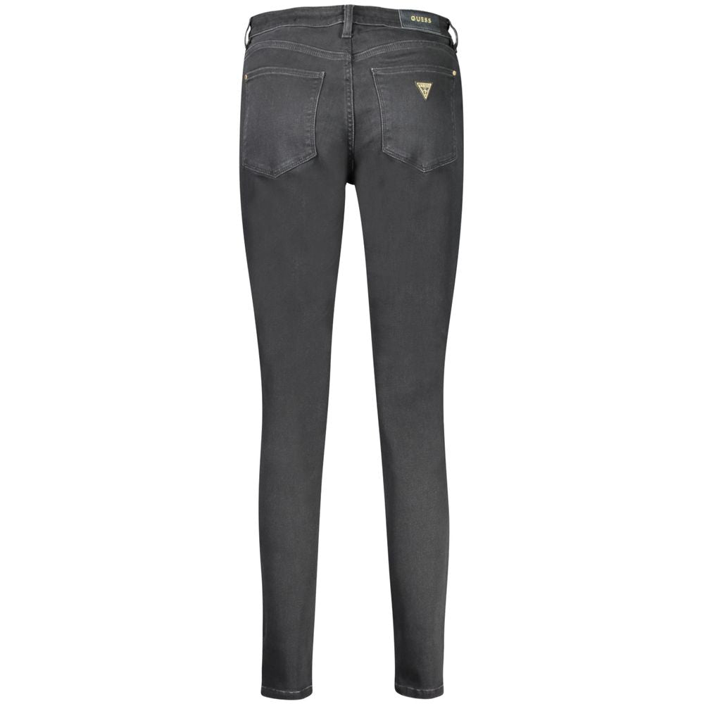 Black cotton women's skinny jeans by Guess Jeans, fitted style with classic five-pocket design and belt loops.