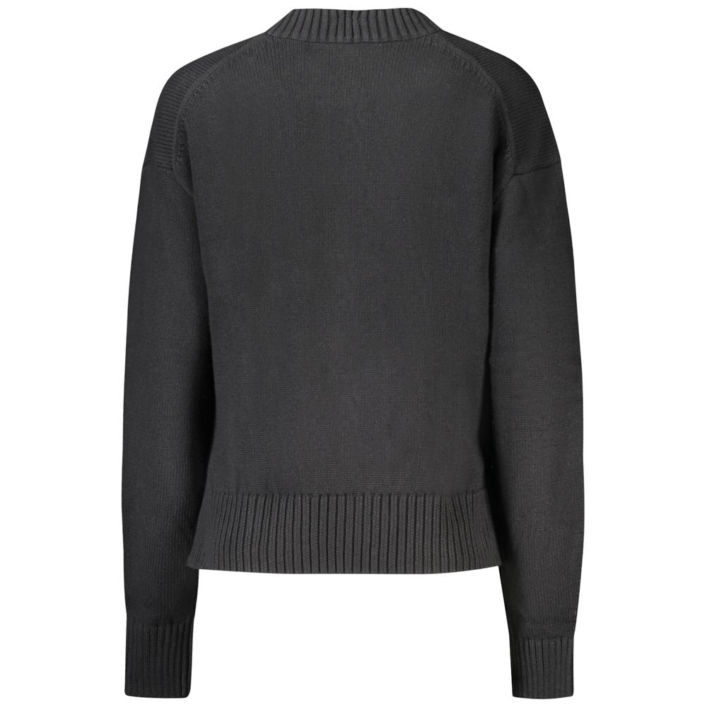 Black cotton women's sweater by Calvin Klein, soft knit with long sleeves and a classic crew neckline.