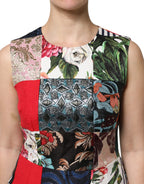 Dolce & Gabbana multicolor patchwork sleeveless sheath dress displayed on a mannequin, showcasing vibrant fabric and fitted silhouette.
