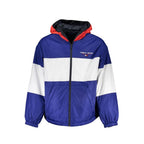 Tommy Hilfiger men's blue polyester jacket displayed on a hanger, featuring a front zipper and classic style.