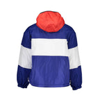 Tommy Hilfiger men's blue polyester jacket hanging on a wooden hanger, front view showing zip closure and collar.