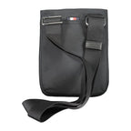 Tommy Hilfiger black polyester men's shoulder bag with adjustable strap and front logo patch, casual accessory for everyday use.