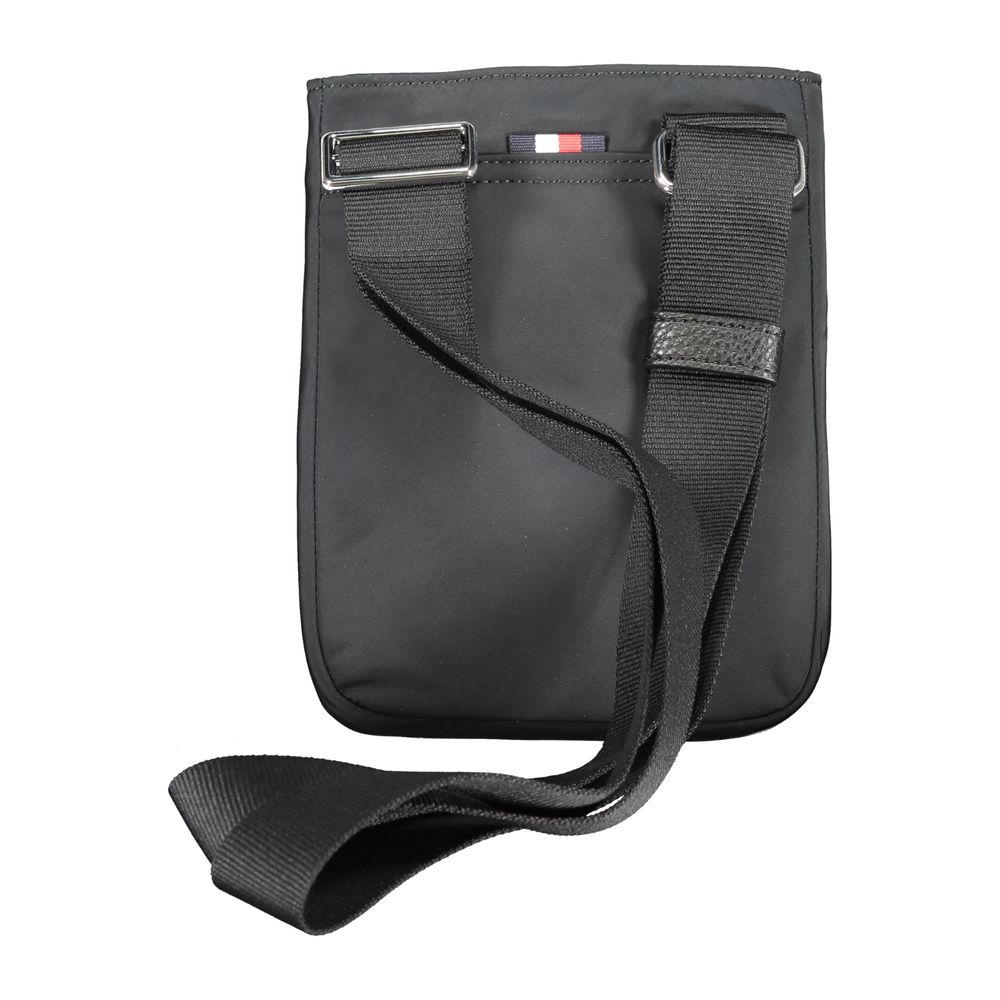 Tommy Hilfiger black polyester men's shoulder bag with adjustable strap and front logo patch, casual accessory for everyday use.