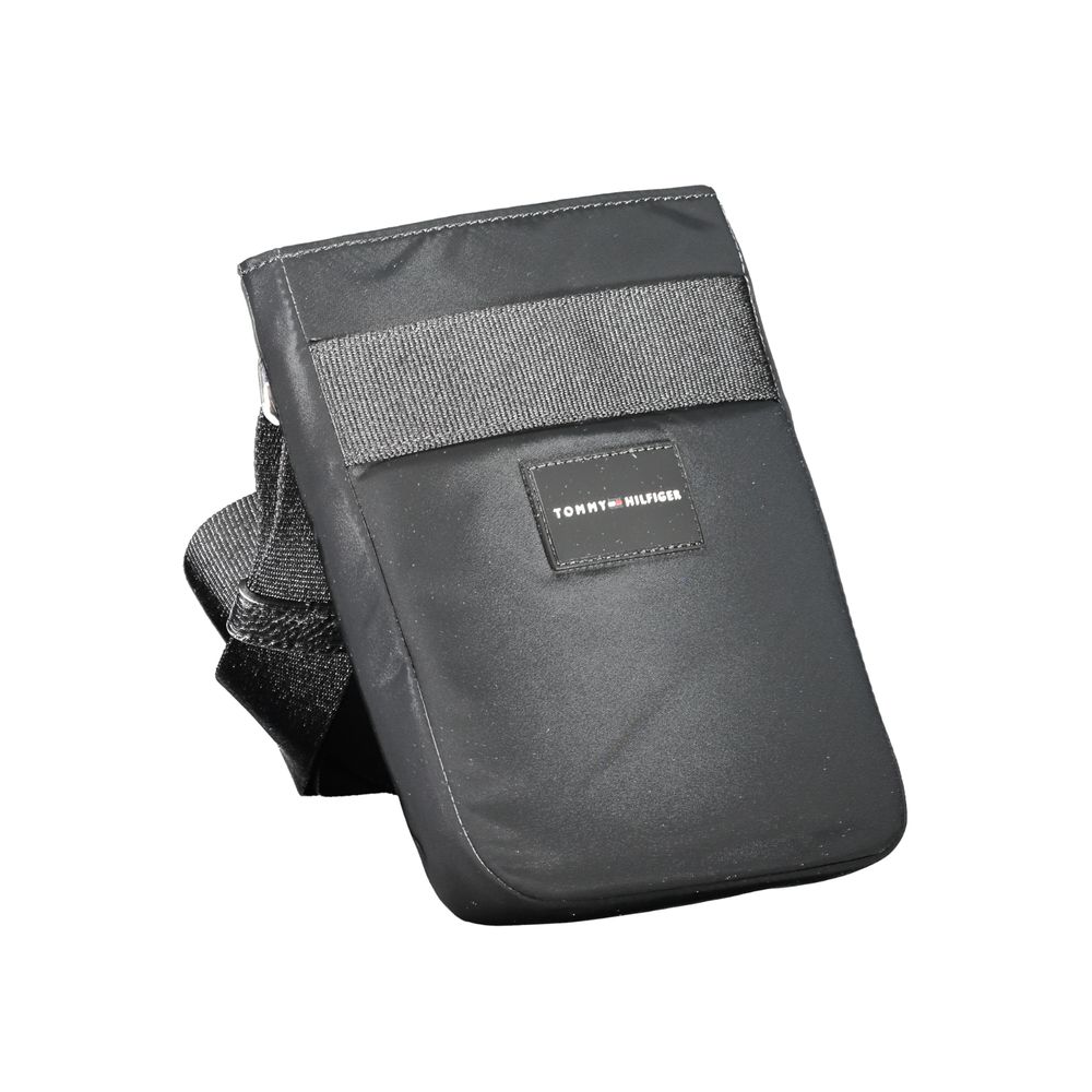 Tommy Hilfiger black polyester men's shoulder bag with adjustable strap and front logo detail.