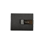 Calvin Klein sleek leather card holder with built-in money clip on a neutral background.