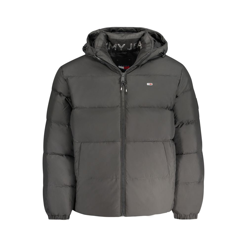 Tommy Hilfiger black polyester men's jacket displayed on a hanger, featuring a sleek design and classic style.
