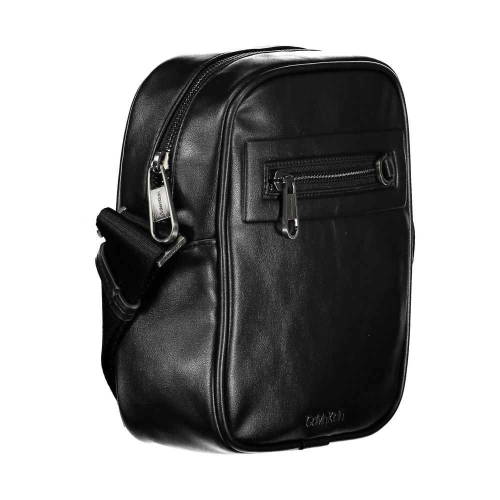 Calvin Klein sleek black urban shoulder bag with minimalist design and adjustable strap, ideal for everyday use.