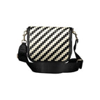 Tommy Hilfiger black polyurethane women’s handbag with sleek design and silver hardware, featuring top handles and zip closure.