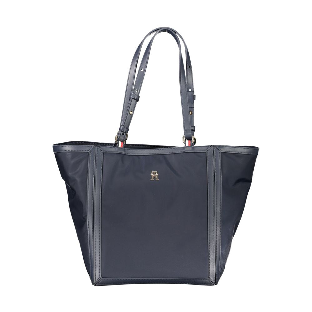 Tommy Hilfiger blue polyester women's handbag with sleek design and silver hardware, showcasing a stylish accessory for everyday use.