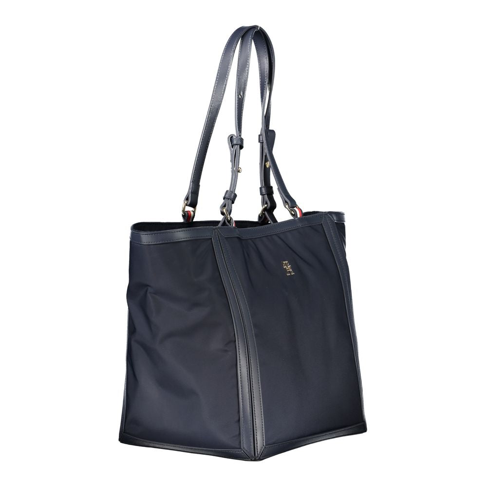 Tommy Hilfiger blue polyester women's handbag with handles and logo detail, stylish and spacious accessory for daily use.