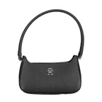 Tommy Hilfiger black polyurethane women's handbag with sleek design and top handle, showing front view with logo detail.