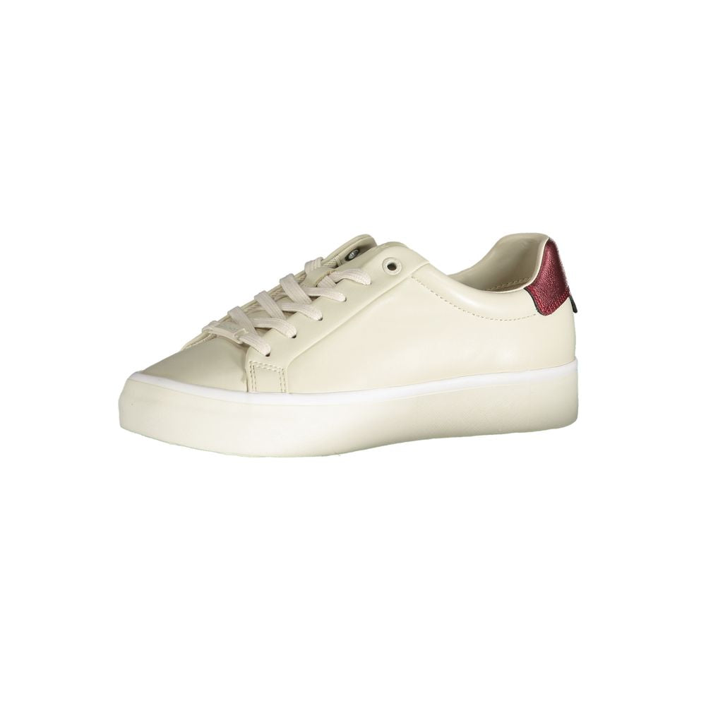 Calvin Klein beige leather women’s sneaker with white sole and sleek design, showcasing stylish casual footwear.