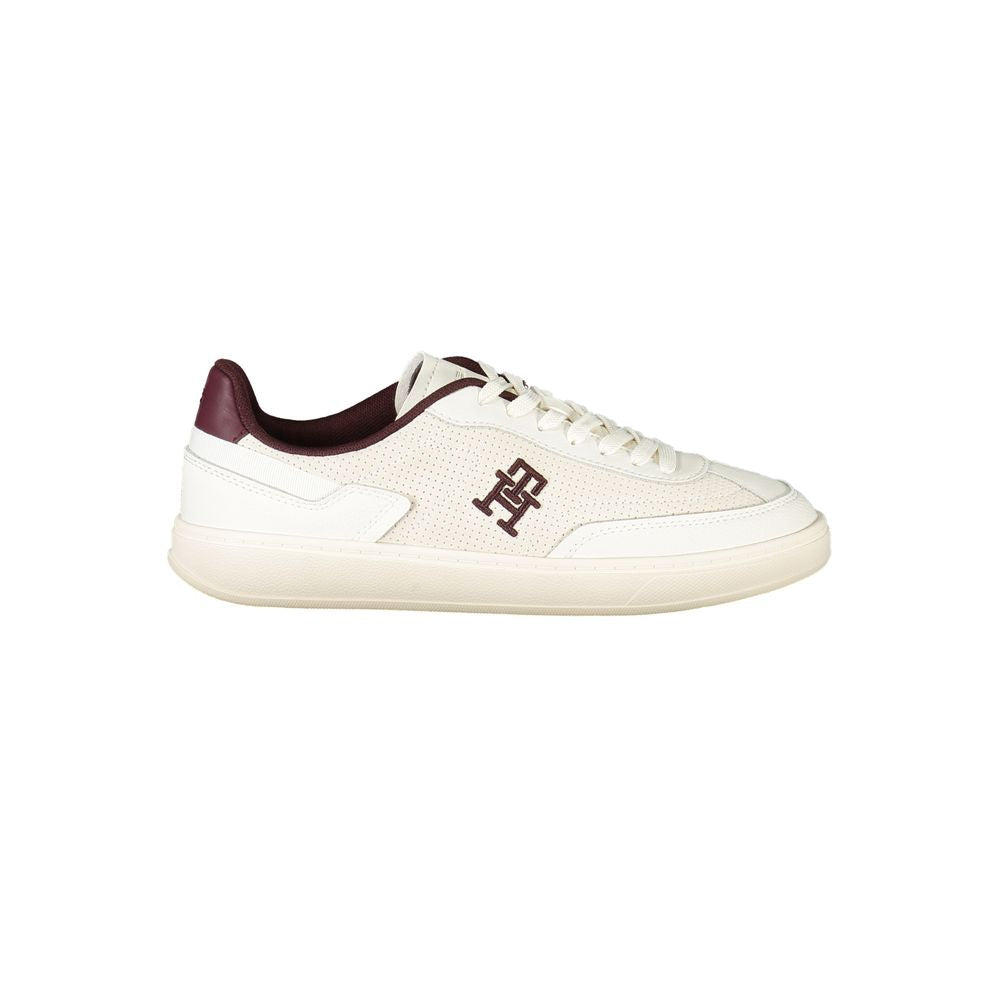 Beige Tommy Hilfiger women's sneaker with polyurethane upper, casual style, featuring white sole and classic branding details.