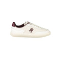 Beige Tommy Hilfiger women's sneaker with polyurethane upper, casual style, featuring white sole and classic branding details.
