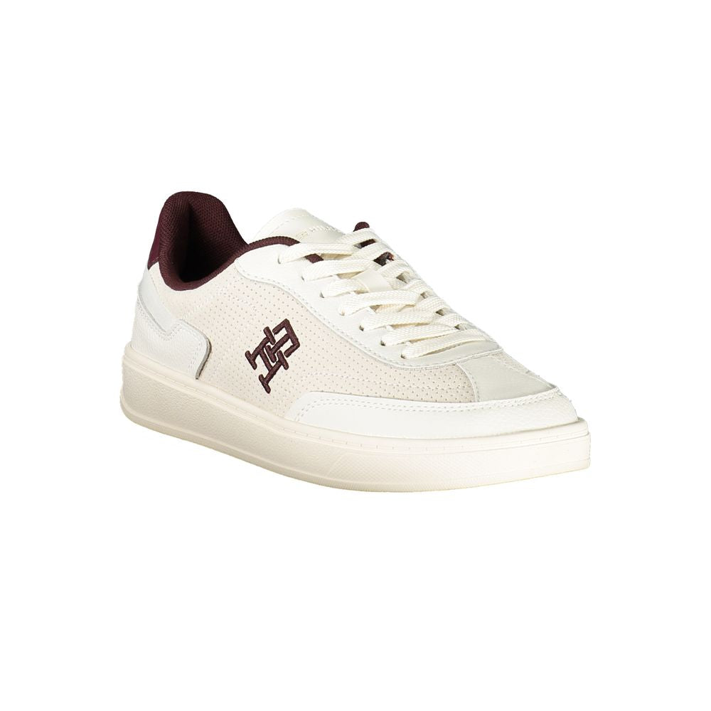 Beige Tommy Hilfiger women's sneaker with polyurethane upper, casual athletic shoe with white sole and stylish design.