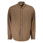 Timberland blue cotton men's shirt displayed on a hanger, featuring a classic button-up design with a collar and long sleeves.