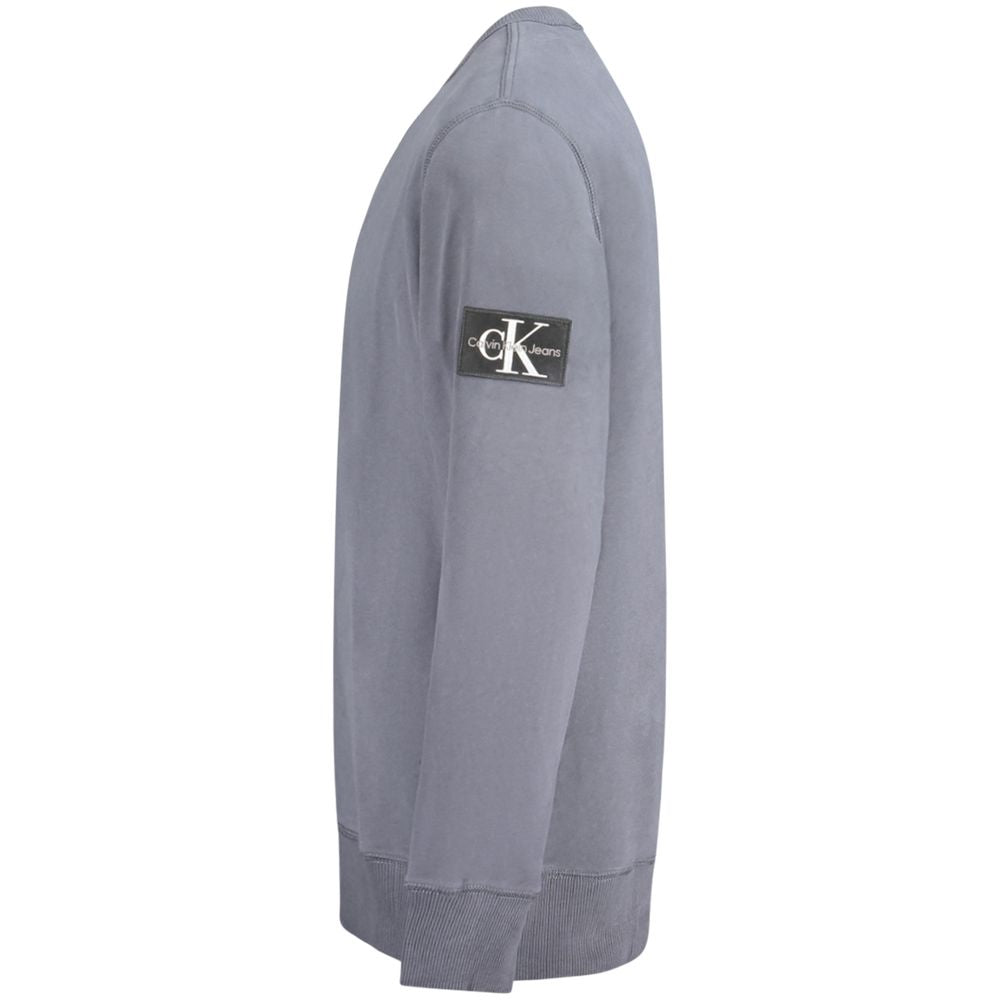 Calvin Klein blue cotton men's sweater with crew neck and long sleeves, soft knit fabric, and ribbed cuffs.