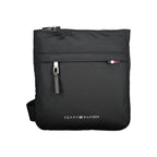 Black Tommy Hilfiger polyurethane women’s shoulder bag with silver hardware and adjustable strap, stylish and functional accessory.