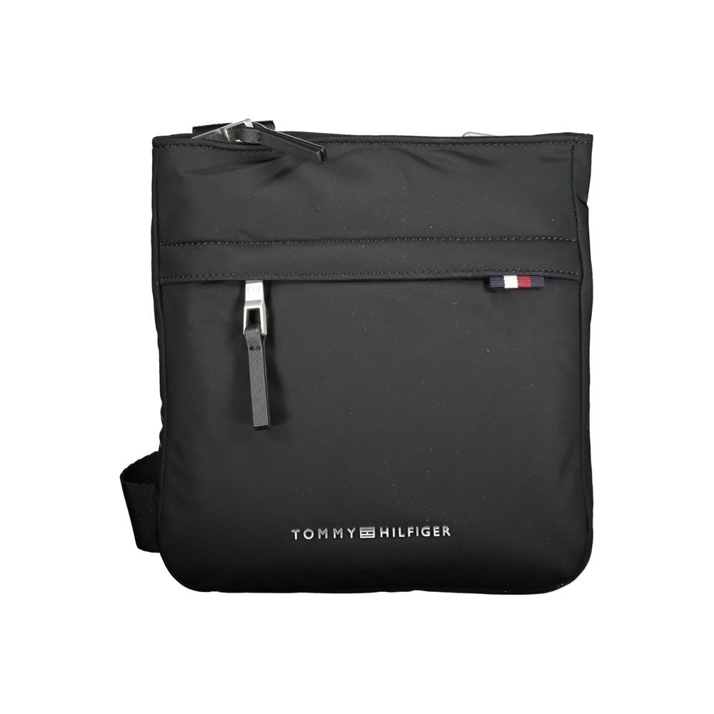 Black Tommy Hilfiger polyurethane women’s shoulder bag with silver hardware and adjustable strap, stylish and functional accessory.