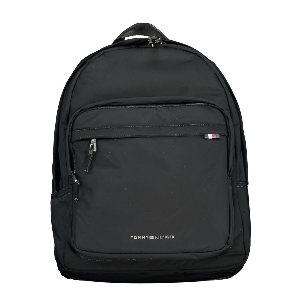 Tommy Hilfiger black polyester men's backpack with multiple compartments and adjustable straps, featuring the brand's logo.