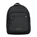 Tommy Hilfiger black polyester men's backpack with multiple compartments and adjustable straps, featuring the brand's logo.