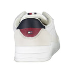 White leather men's sneaker by Tommy Hilfiger with a sleek design and brand logo on the side.