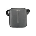 Calvin Klein black polyester men's shoulder bag with adjustable strap and minimal branding, suitable for casual and professional use.