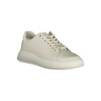 Calvin Klein beige leather women's sneaker with white sole and minimalist design, showcasing a comfortable and stylish footwear option.