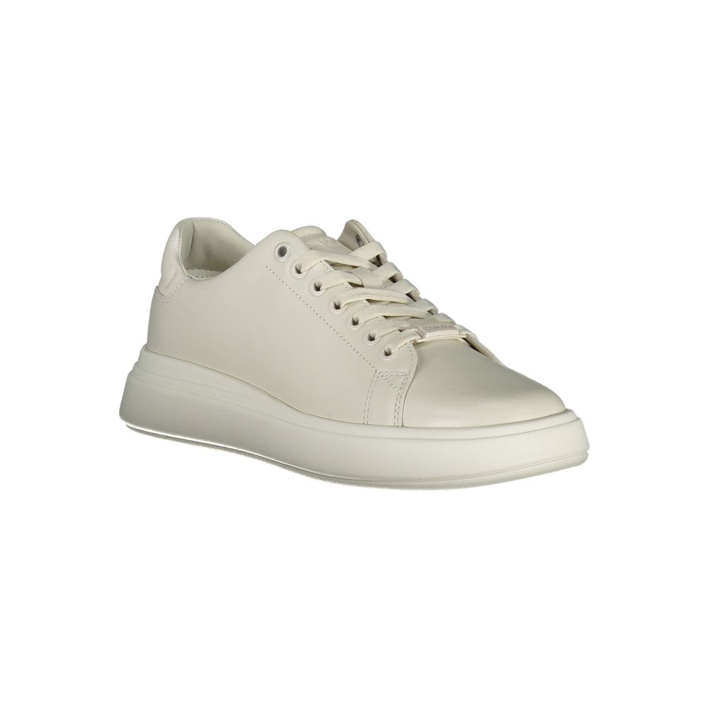 Calvin Klein beige leather women's sneaker with white sole and minimalist design, showcasing a comfortable and stylish footwear option.