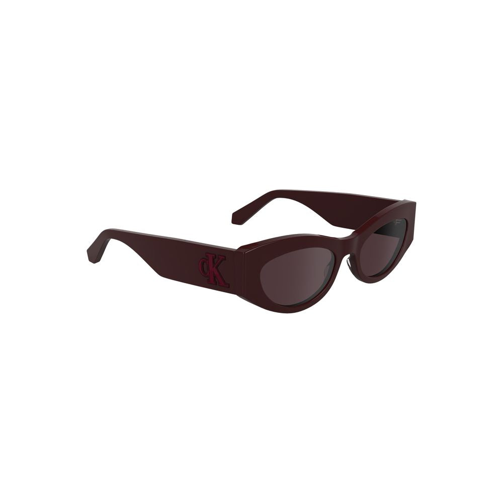 Calvin Klein Rosso acetate women's sunglasses with rounded frames and dark tinted lenses, stylish and fashionable eyewear.