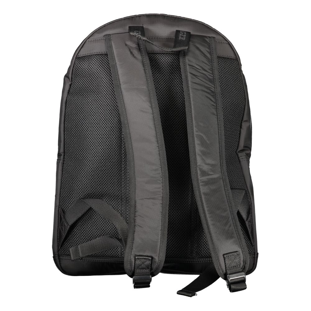 Tommy Hilfiger black polyurethane men's backpack with adjustable straps and front zip pocket, stylish and durable for everyday use.