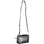 Black Calvin Klein polyester shoulder bag with sleek design and adjustable strap, suitable for women.
