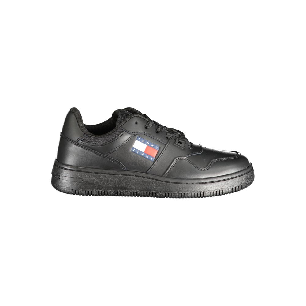 Black leather women's sneaker by Tommy Hilfiger featuring a sleek design and white sole detail.